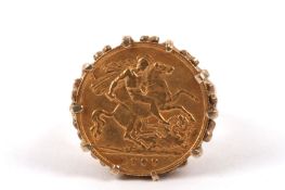 A 1909 fine gold half sovereign set in a 9ct gold gentleman's ring mount size R/S Weight approx.