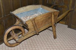 A French fruit wood wheelbarrow, late 19th century of typical form with rectangular section