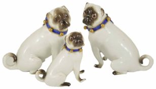 A pair of Meissen porcelain Pug Dogs, 19th century each in a seated position, with white body, faces