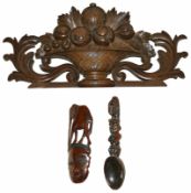 A tribal wooden spoon wall hanging, 20th century together with a Modern tribal wooden elephant and