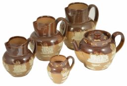 A series of Royal Doulton Jugs with teapot the four graduated jugs with figural and windmill applied