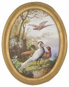A late 19th Century oval painted porcelain panel depicting grouse/pheasant in woodland
