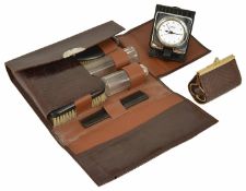 A gentleman's travelling companion set, 20th century in a crocodile style flap-over case, comprising