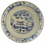 A large Chinese late 17th/18th Century Swatow blue and white pottery charger the centre painted with