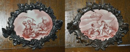 A pair of oak carved and porcelain plaques, late 19th century the first oval porcelain plaque