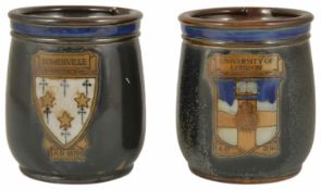 Two Royal Doulton pottery Tobacco jars each with a crest on the front, 'Somerville AD 1879' and '