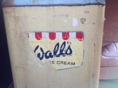 A vintage Walls commercial freezer circa 1960 with rubber twin lids to the top, and Walls transfer