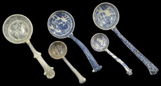 A collection of transfer printed ceramic ladles, 19th century and later four with blue and white