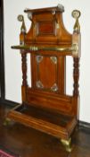A Victorian brass bound oak umbrella stand the upper section with brass gallery rail above central