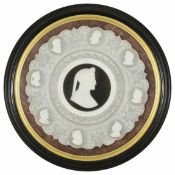 A Victorian carved alabaster plaque of nine Philosopher's profiles the scalloped edge with eight