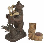 A Black Forest bear pipe rack, 20th century the standing bear holding a removable barrel, raised