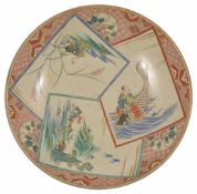 A 19th century Japanese Au Kutani charger painted with a trip of panels depicting a mountainous