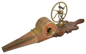 A mechanical brass and mahogany fire bellows, early 20th century of typical form with a shaped