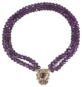 An unusual amethyst bead necklace the two rows of facetted amethyst beads with central amethyst