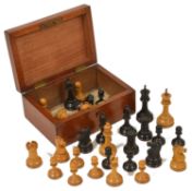 A mahogany cased chess set probably by Jaques Staunton, comprising of 32 pieces, a rook and a knight