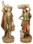 A tall pair of Royal Dux Water Carrier Figurines, late 19th/early 20th century of tall