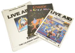 Three items of rock ephemera including a Live Aid programme together with an official Live Aid