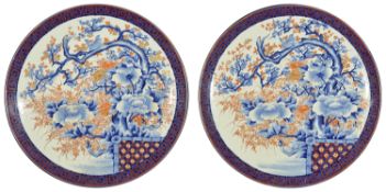 A pair of very large Japanese Imari circular chargers, circa 1900 the centre painted with a bird