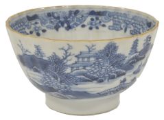 A blue and white porcelain tea bowl, 18th century, possibly Caughley, of circular gadrooned form,