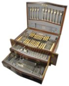 An impressive mahogany canteen of silver cutlery, Sheffield 1918 comprising six serving spoons,