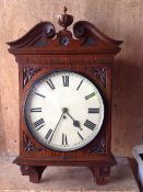 A late 19th century mahogany wall clock with scrolled mahogany pediment the painted dial with