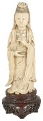 An ivory figural carving of Quan Lin, early 20th century modelled standing wearing trailing robes