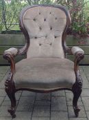 A Victorian mahogany button back upholstered armchair with scrolled front supports height: 92 cm,