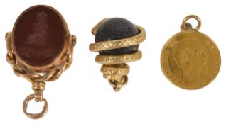 A Victorian gold mounted carnelian and bloodstone swivel fob with carved armorial, together with a