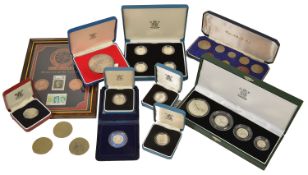 A collection of British Coinage to include a cased set of four £1 silver proof coins, a cased 25th