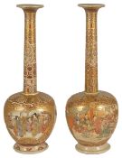 A pair of Satsuma bottle vases of unusual slender neck bottle form, circa 1900 the flaring rims