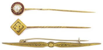 An Edwardian ruby and diamond set stick pin the central old cut diamond approx. 0.25 ct. within a