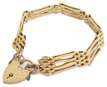 A Edwardian 9ct gold fancy four bar gate bracelet with heart padlock fastening the inner shaped bars