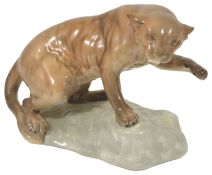 A Beswick puma on rock, 1960's realistically modelled in a tawny gloss standing on a rock with one