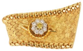 A good quality Continental fancy yellow diamond cluster 'ribbon' lapel pincirca 1970, formed as an