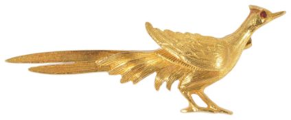 A 9ct gold pheasant broochhaving ruby set eye and naturalistic engraved feather detail, fully marked