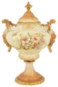 A Rudolstadt porcelain pedestal urn with cover, early 20th centurythe blush ivory coloured painted