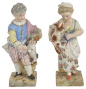 A pair of Meissen porcelain figurines, late 19th century,modelled as a boy with a dog on his heels