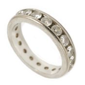 An elegant channel set diamond full eternity ringthe white metal mount encasing twenty brilliant cut