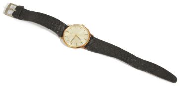 An Omega 14ct gold gentleman's wristwatchwith black and gold baton hours, index hands, Omega logo on