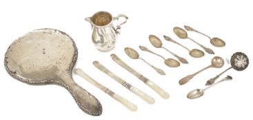 A small collection of silvercomprising a silver cream jug, hallmarked London 1966 of baluster form