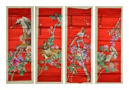 A set of four Chinese red silk wall hangings, 20th centuryeach embroidered with colourful flower