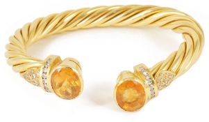 An attractive Continental 18ct gold yellow gem and diamond twist torque banglethe open ended