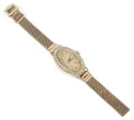 An Edwardian ladies platinum and diamond cocktail wristwatch, the oval dial with arabic hours and