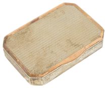 A Continental silver gilt rectangular canted box, the engine turned base and hinged top with swags