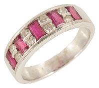 A good quality ruby and diamond set platinum half eternity ring