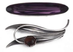 A contemporary silver mounted amber set twin leaf brooch