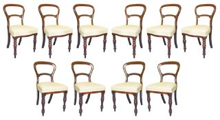 A suite of ten Victorian mahogany balloon back dining chairs