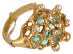 An unusual modernist design emerald and diamond set cocktail ring,