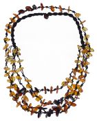 A modern polished amber and silk multi strand necklace