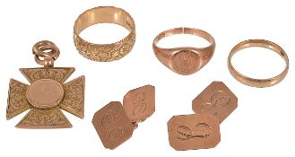 An Edwardian 9ct rose gold floral engraved wedding band and others,